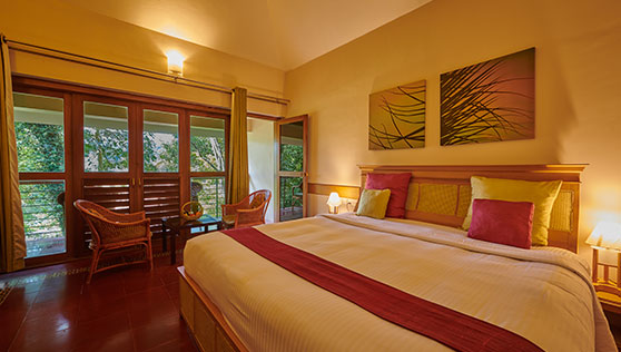 Large comfortable beds in a private cottage with balcony